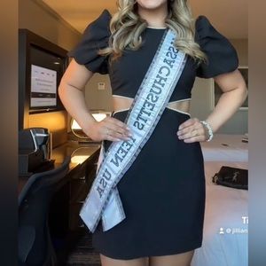 LIKELY black mini dress with pearl detailing. Worn once.